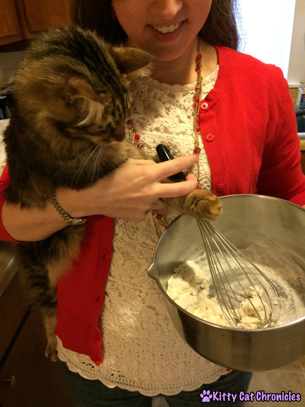 Photo: Caster helping to mix the ingredients